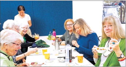 Residents enjoy feast after cooking demonstration