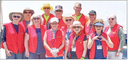 Volunteers serve 350 vehicles at shredding event