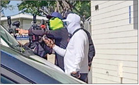 Masked First Amendment auditors goad customers at local USPS