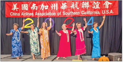 Hula dancers practice ‘Here Comes Santa in a Red Canoe’